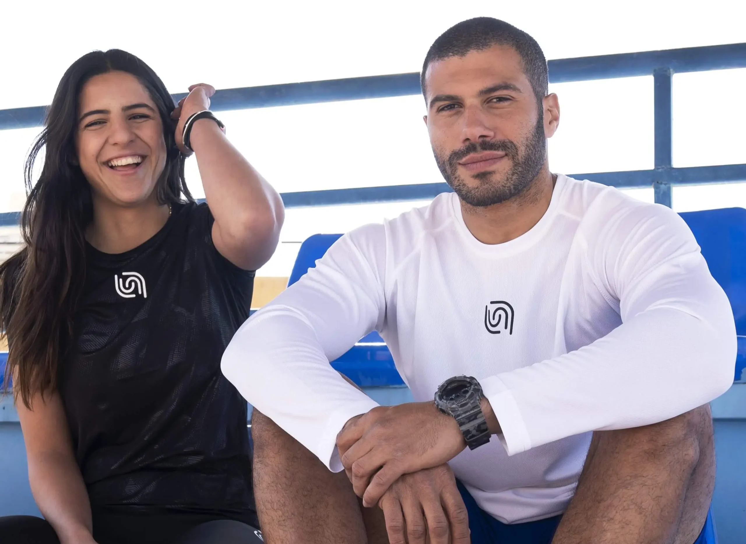 Founders of Beyond brand sitting together, representing the team behind the sportswear company